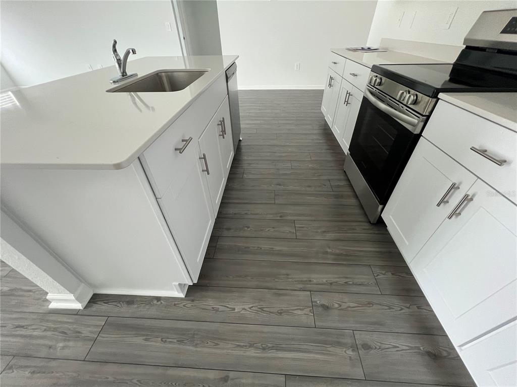4576 Southwest 84th St Road Ocala, FL 34476 - Photo 9 of 50 a kitchen with sink and cabinets