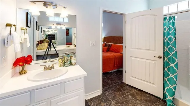 a bathroom with a sink and a mirror