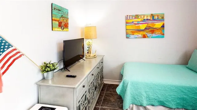 a bathroom with a toilet and a shower curtain