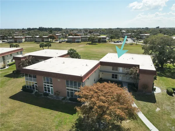 an aerial view of a house with lake view