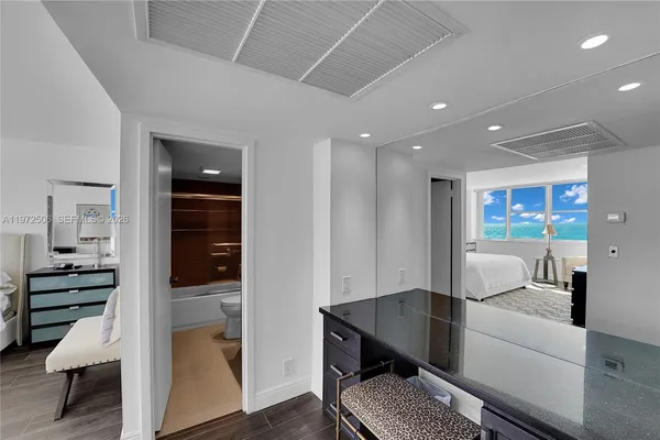 a view of a hallway with seating area