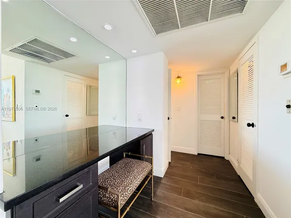 a bedroom with a bed and dresser