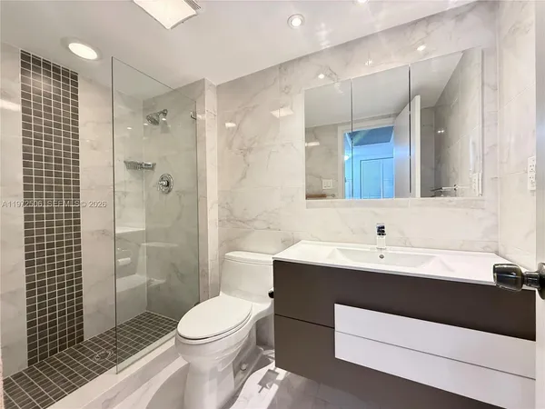 a bedroom with a bed and large window