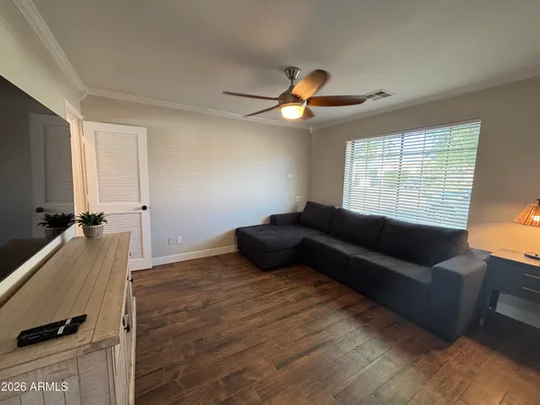a bathroom with a toilet and a glass door