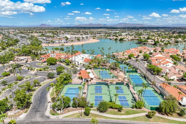 a view of a swimming pool with a yard