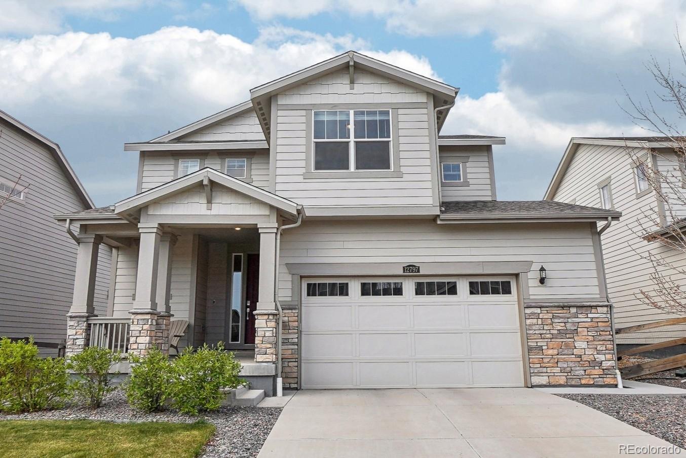 12797 Clearview Street Firestone, CO 80504 - Photo 1 of 44 a front view of a house with a garage