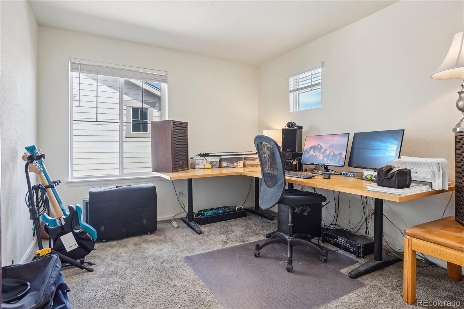 12797 Clearview Street Firestone, CO 80504 - Photo 21 of 44 a view of a workspace with furniture and a window