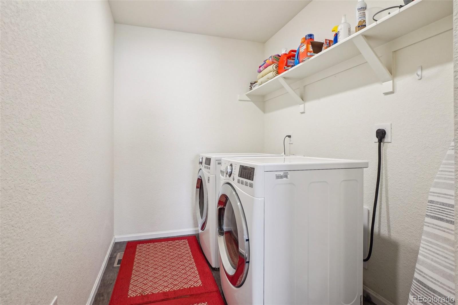 12797 Clearview Street Firestone, CO 80504 - Photo 22 of 44 a utility room with dryer and washer