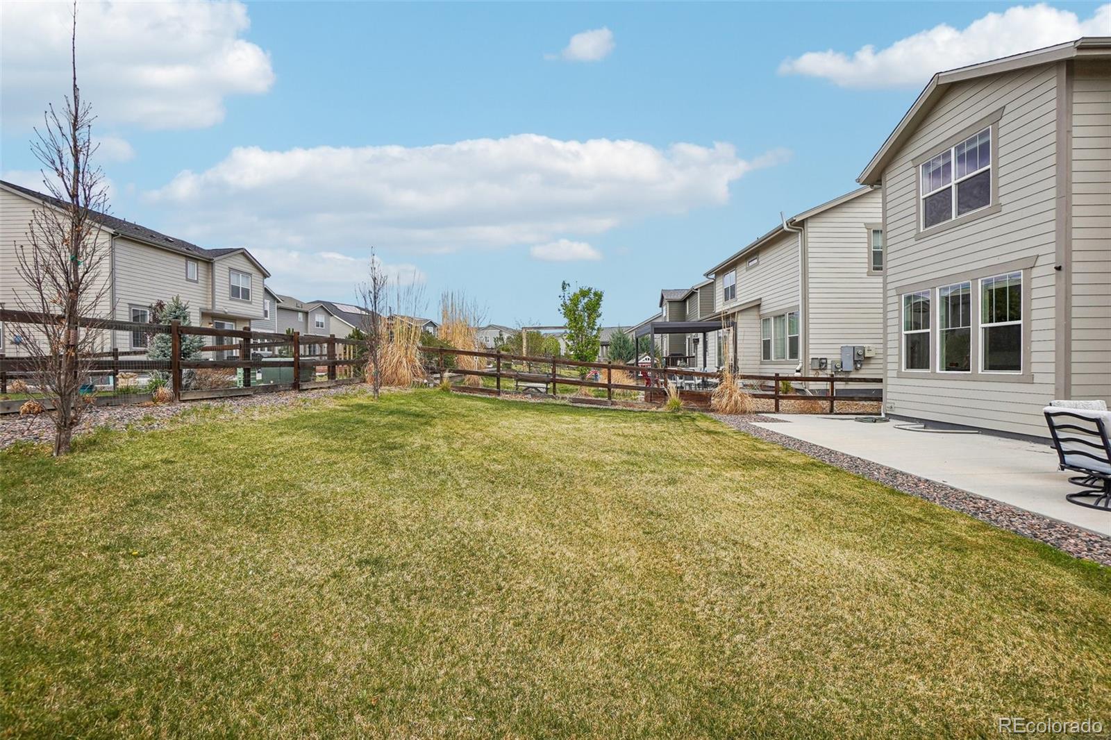 12797 Clearview Street Firestone, CO 80504 - Photo 25 of 44 a swimming pool with outdoor seating and yard