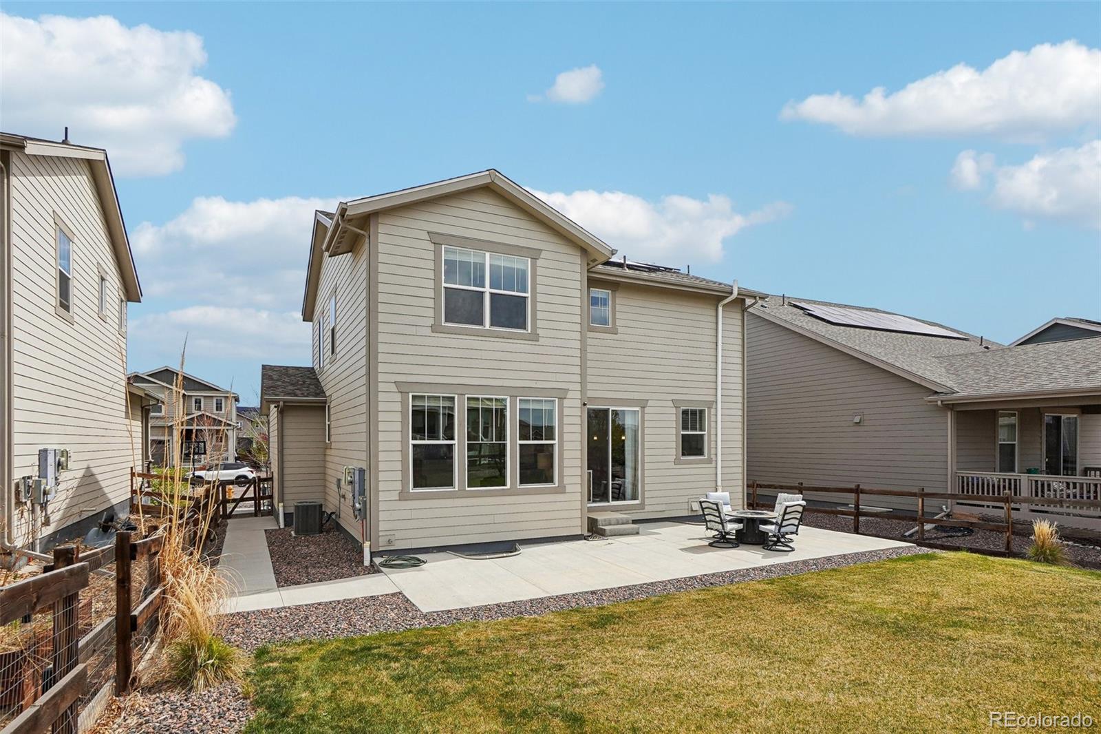 12797 Clearview Street Firestone, CO 80504 - Photo 26 of 44 a view of a house with swimming pool and sitting area