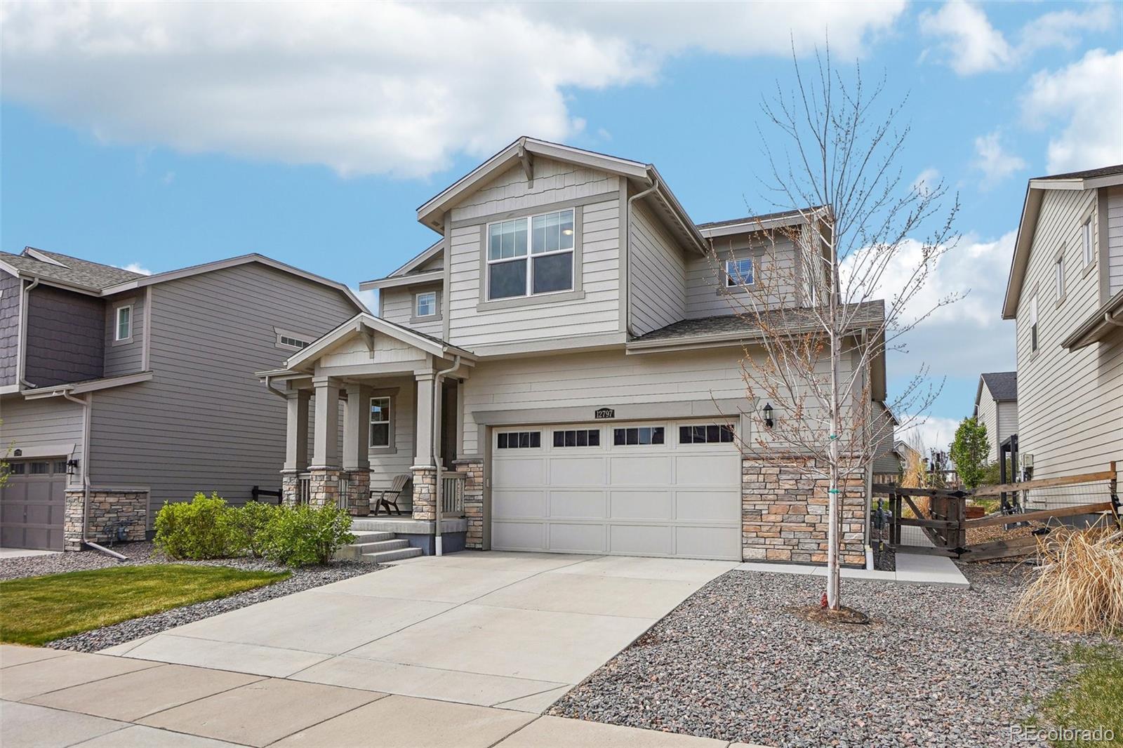 12797 Clearview Street Firestone, CO 80504 - Photo 27 of 44 a front view of a house with garden