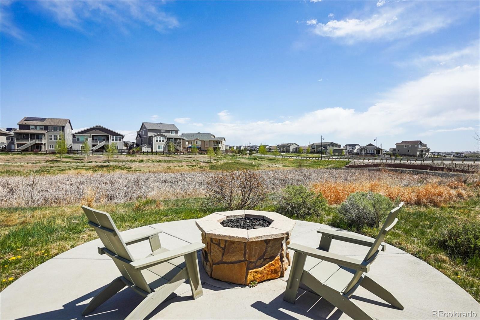 12797 Clearview Street Firestone, CO 80504 - Photo 34 of 44 a view of a lake with couches in the patio