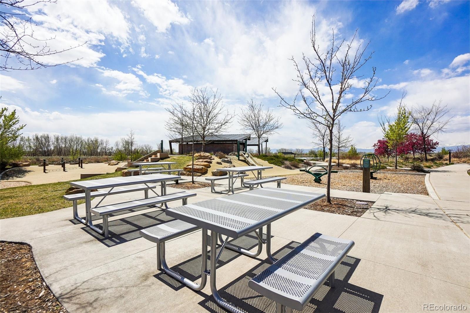12797 Clearview Street Firestone, CO 80504 - Photo 40 of 44 a view of swimming pool with outdoor seating and city view