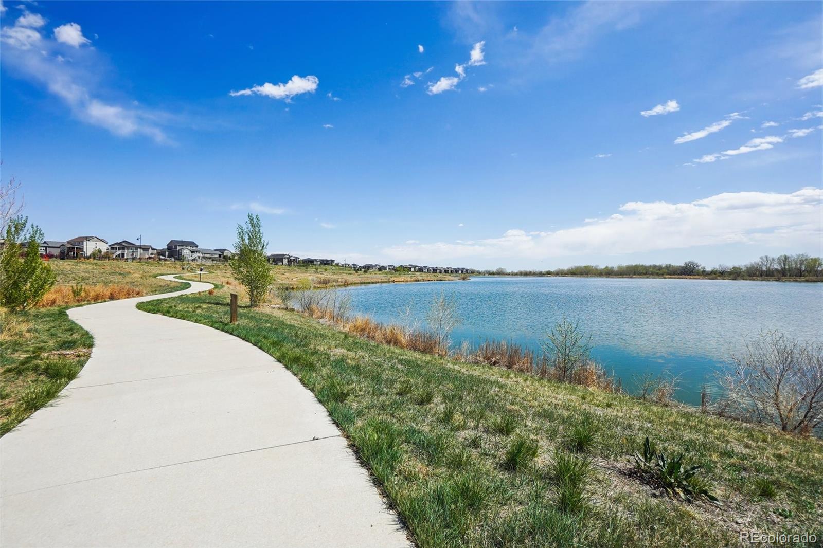 12797 Clearview Street Firestone, CO 80504 - Photo 43 of 44 a view of a lake with a yard