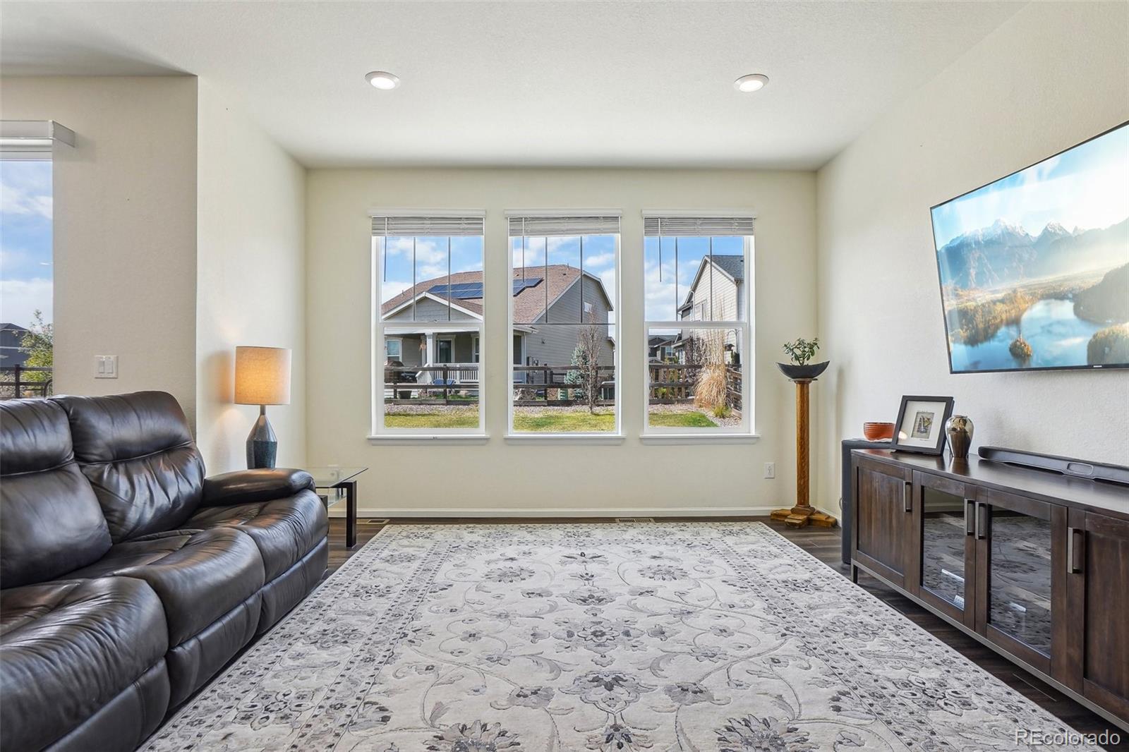 12797 Clearview Street Firestone, CO 80504 - Photo 9 of 44 a living room with furniture and a large window