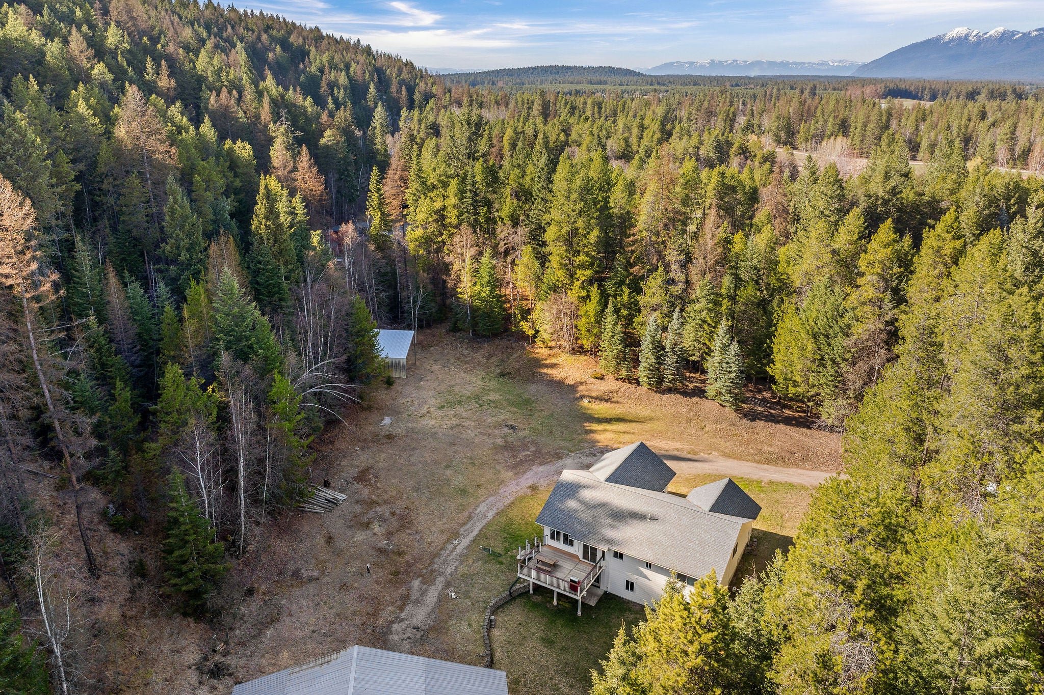 620 Swan River Road Bigfork, MT 59911 - Photo 44 of 50 Aerial of house and meadow