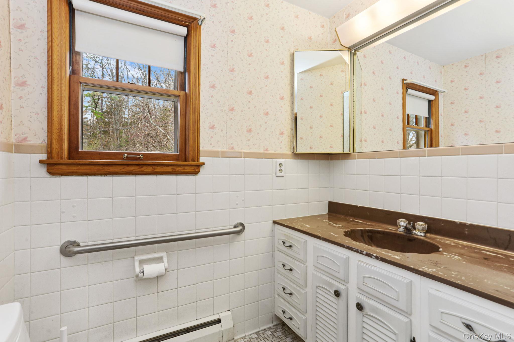770 Gahbauer Road Hudson, NY 12534 - Photo 14 of 39 a bathroom with a sink and a window