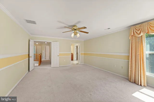 a spacious bathroom with a granite countertop toilet sink and mirror