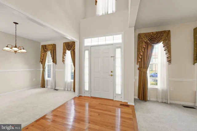 a view of empty room with a fireplace