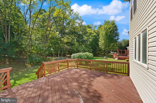 a view of a deck with a backyard