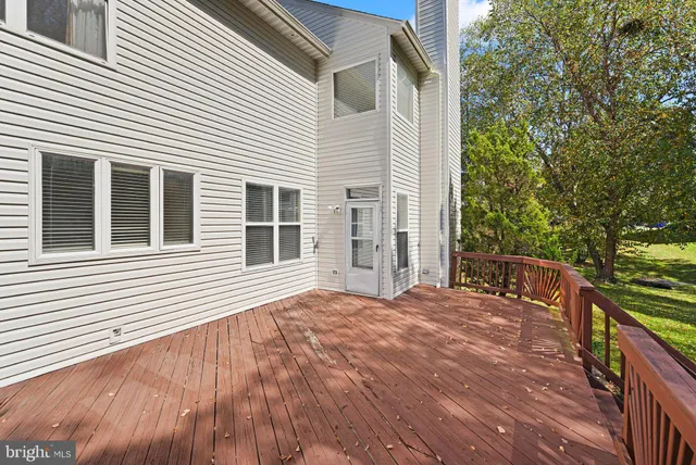 a house view with a sitting space and garden