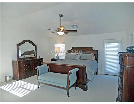 1348 Spice Ridge Court Henderson, NV 89012 - Photo 5 of 8 Master Bedroom. Master bedroom suite includes front and rear facing balconies with mountain views, two walk-in closets and vaulted ceilings. Master bedroom is seperate from bedrooms #3 and #4. (Bedroom #5 is downstairs and serves ideally as an office or retreat.)