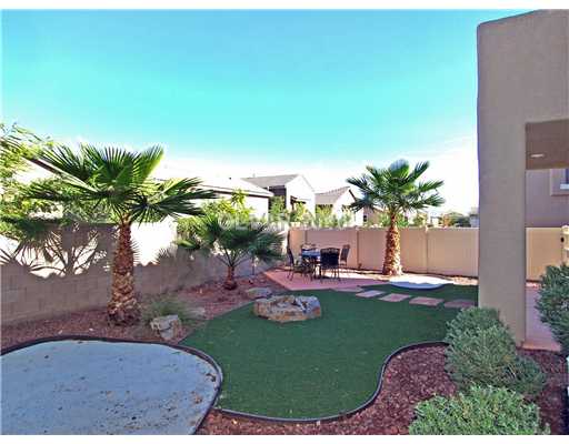 1348 Spice Ridge Court Henderson, NV 89012 - Photo 7 of 8 Yard/Garden. Two sand boxes for the kids or sand traps for the golfer grace the back yard and its pet-friendly artificial turf.Easy care palm trees and comfortable covered patio.