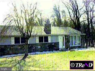 556 Boot Road West Chester, PA 19380 - Photo 1 of 1 a front view of house with yard and trees in the background