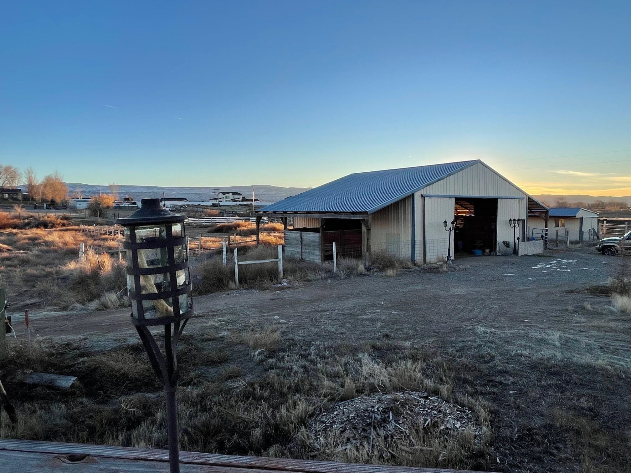 1268-17 17 1/2 Road Fruita, CO 81521 - Photo 16 of 40 a view of a house with backyard and sitting area