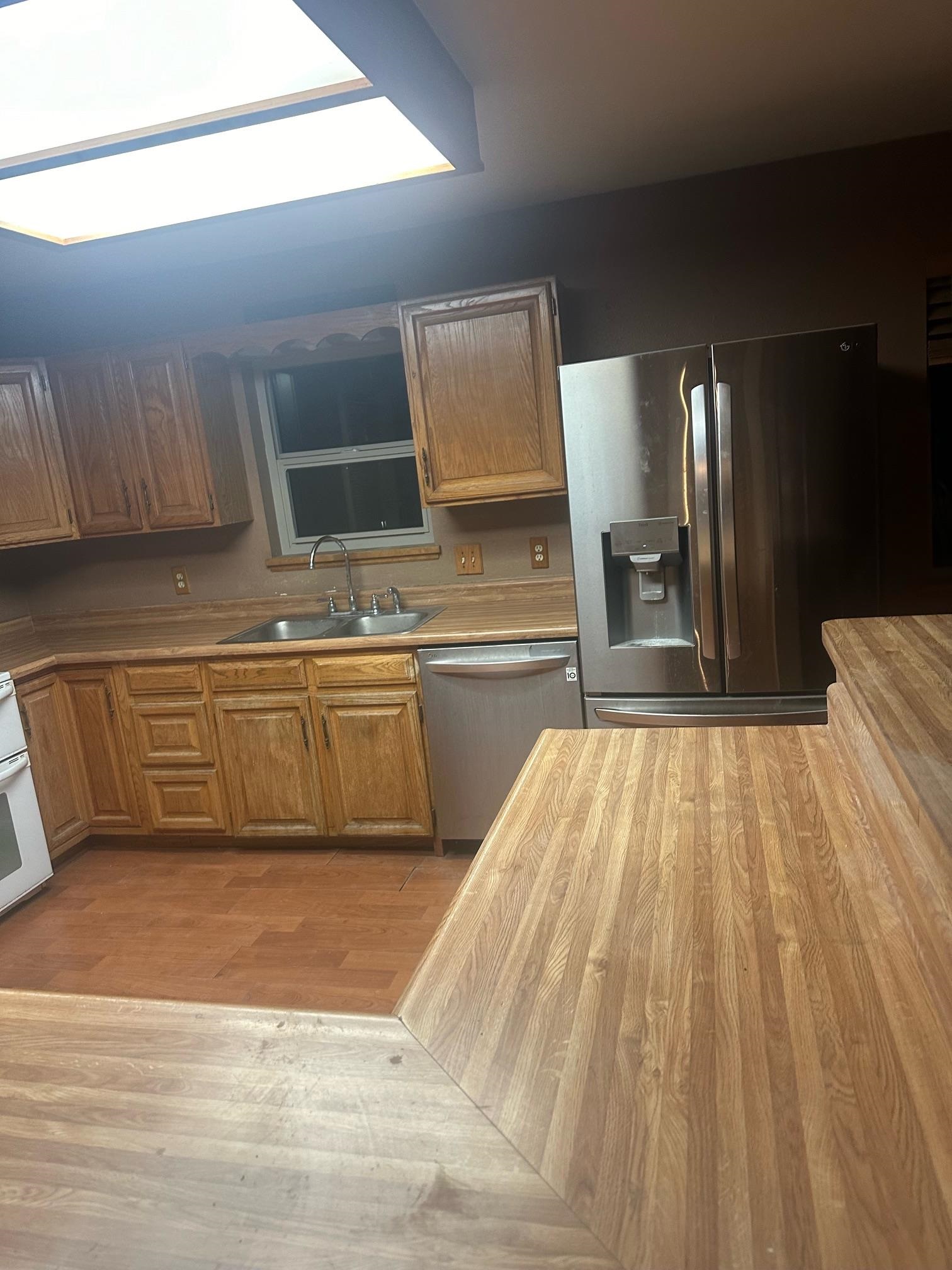 1268-17 17 1/2 Road Fruita, CO 81521 - Photo 27 of 40 a view of a kitchen with kitchen island a sink wooden floor and living room