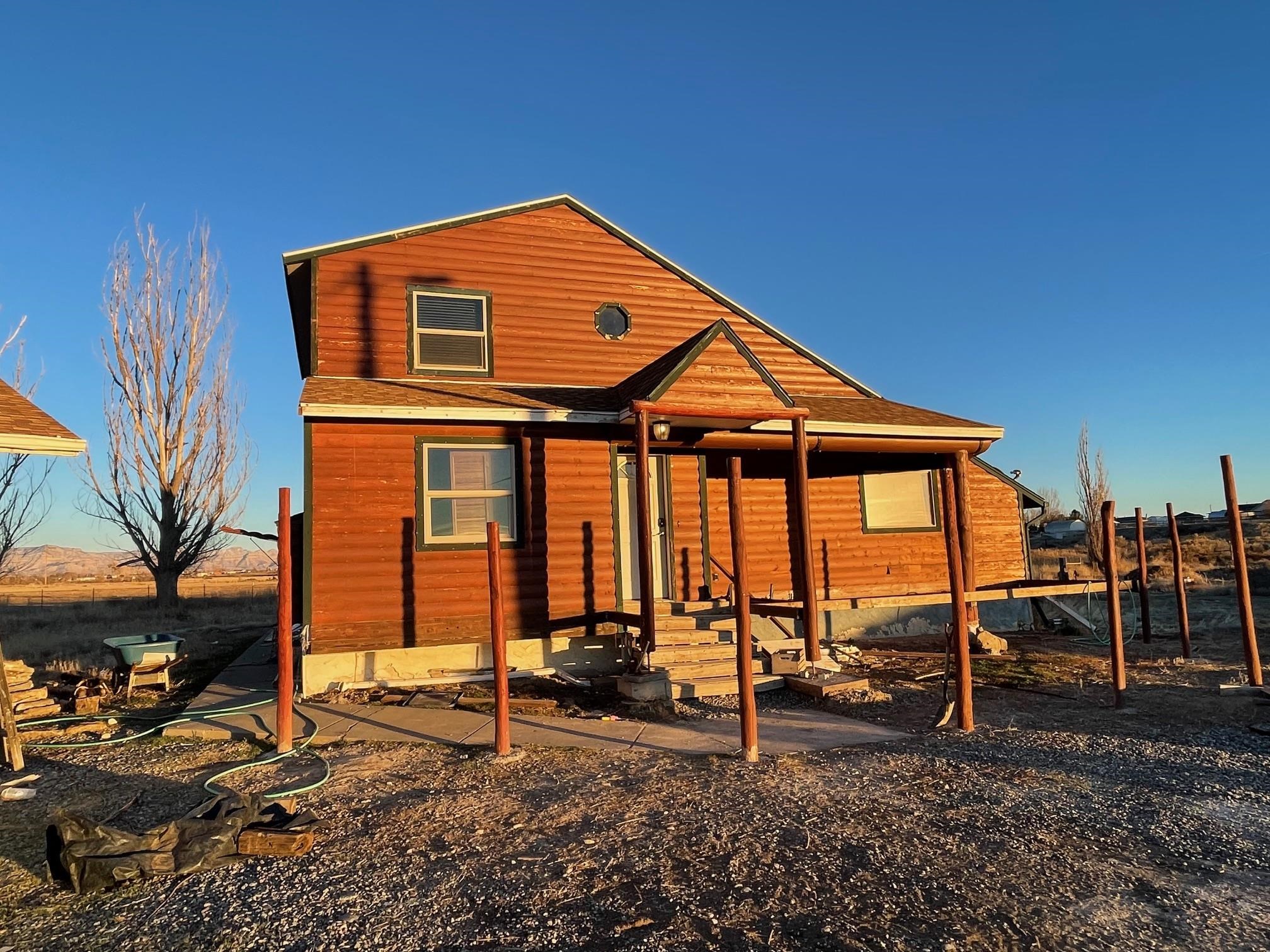 1268-17 17 1/2 Road Fruita, CO 81521 - Photo 7 of 40 a view of a house with a backyard