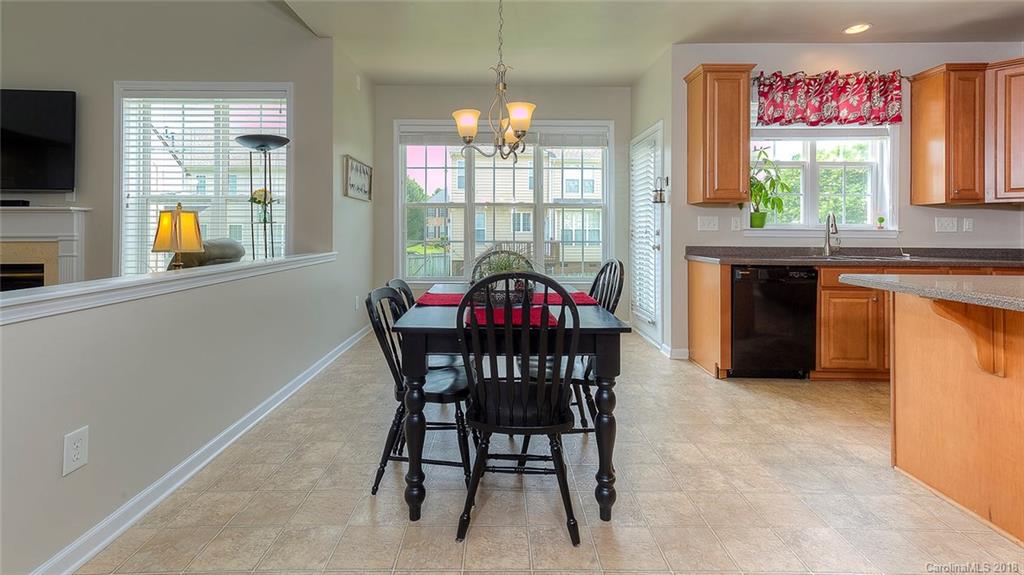 5312 Conant Circle Fort Mill, SC 29708 - Photo 13 of 25 a view of a dining room with furniture and chandelier