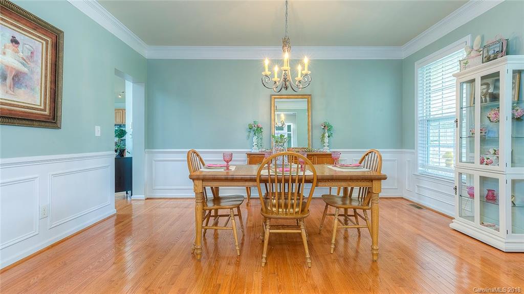 5312 Conant Circle Fort Mill, SC 29708 - Photo 9 of 25 a view of a dining room with furniture wooden floor and chandelier