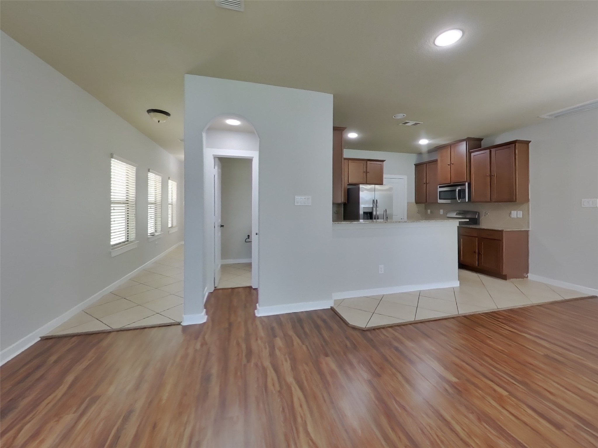 1819 Jara Court Spring, TX 77388 - Photo 4 of 19 a view of a kitchen with wooden floor and a window