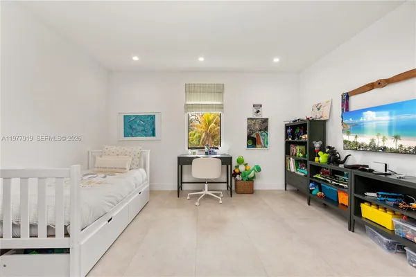 a room with toys and a flat screen tv