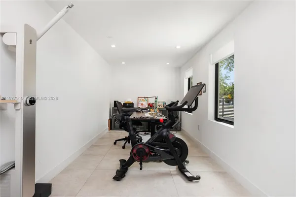 a workspace with furniture and a potted plant