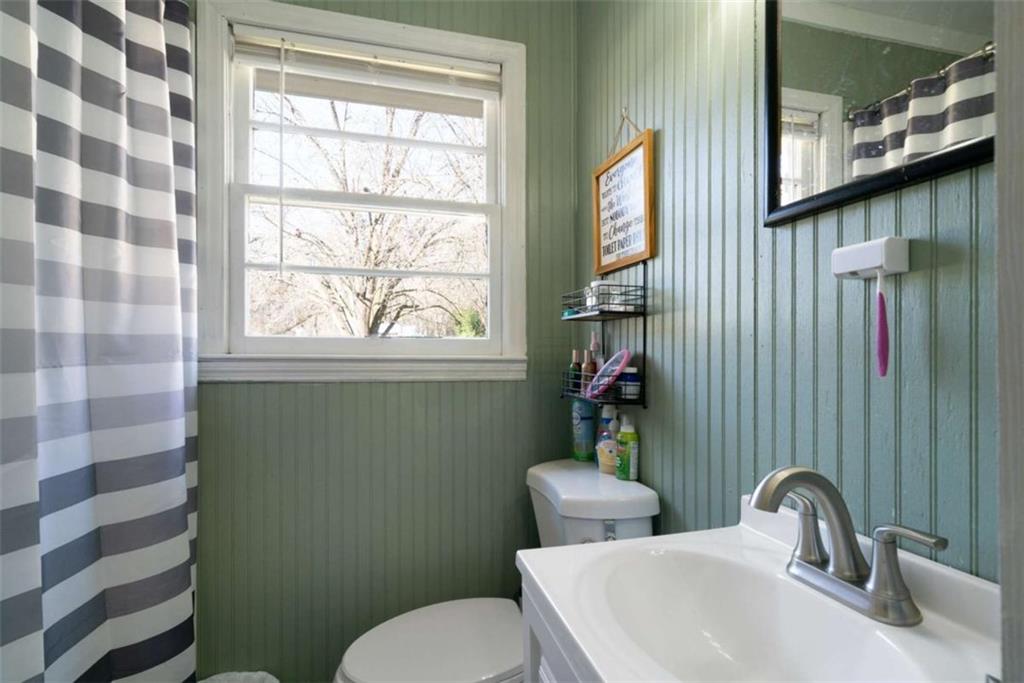 6 Nottingham Way Northeast Rome, GA 30161 - Photo 12 of 16 a bathroom with a toilet sink and mirror