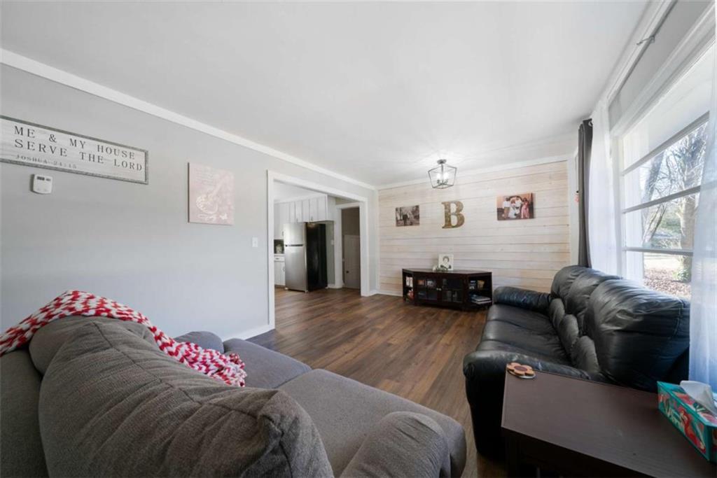 6 Nottingham Way Northeast Rome, GA 30161 - Photo 4 of 16 a bedroom with furniture and a couch