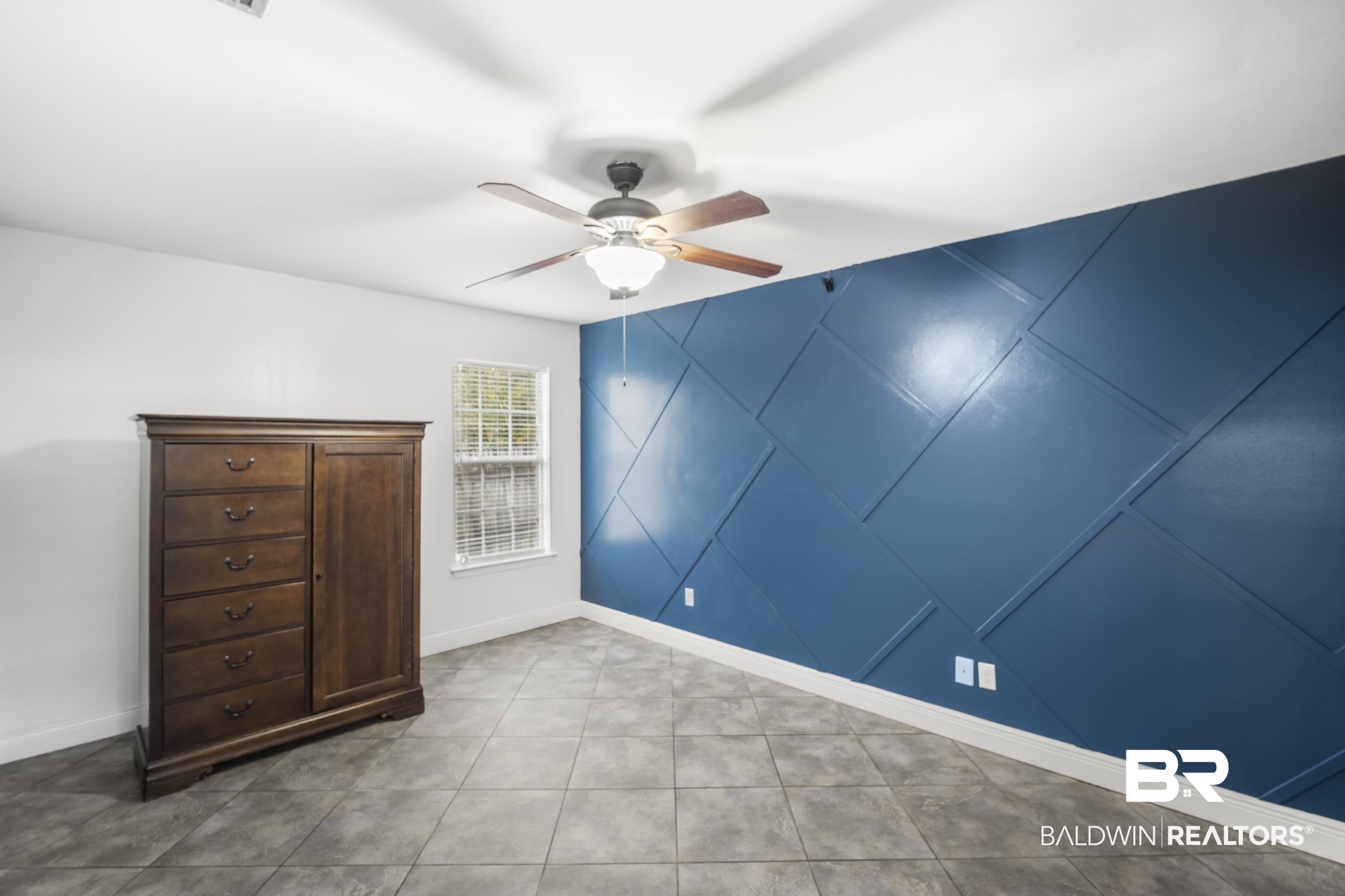 3101 Autumn Ridge Drive West Mobile, AL 36695 - Photo 23 of 36 Tiled bedroom featuring an accent wall, ceiling fan, and a decorative wall