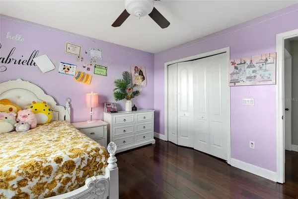 a bedroom with a bed window and a table