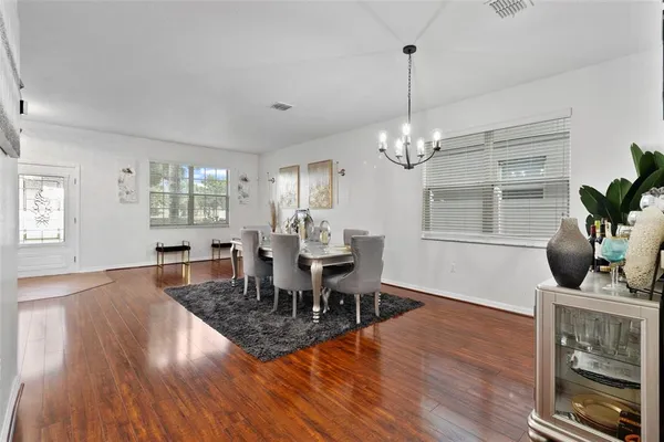 a living room with furniture rug and window