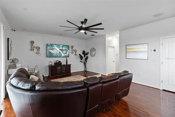 a kitchen with kitchen island granite countertop wooden cabinets and stainless steel appliances