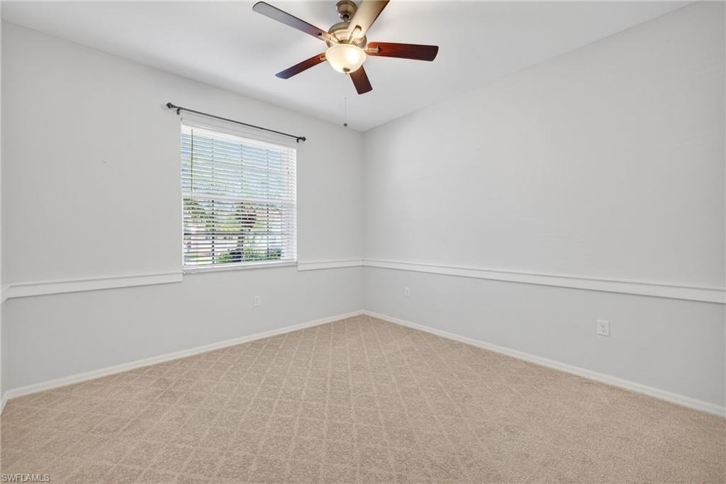 14088 Mirror Court Naples, FL 34114 - Photo 21 of 31 Bedroom 3 featuring light carpet, wainscotting and ceiling fan