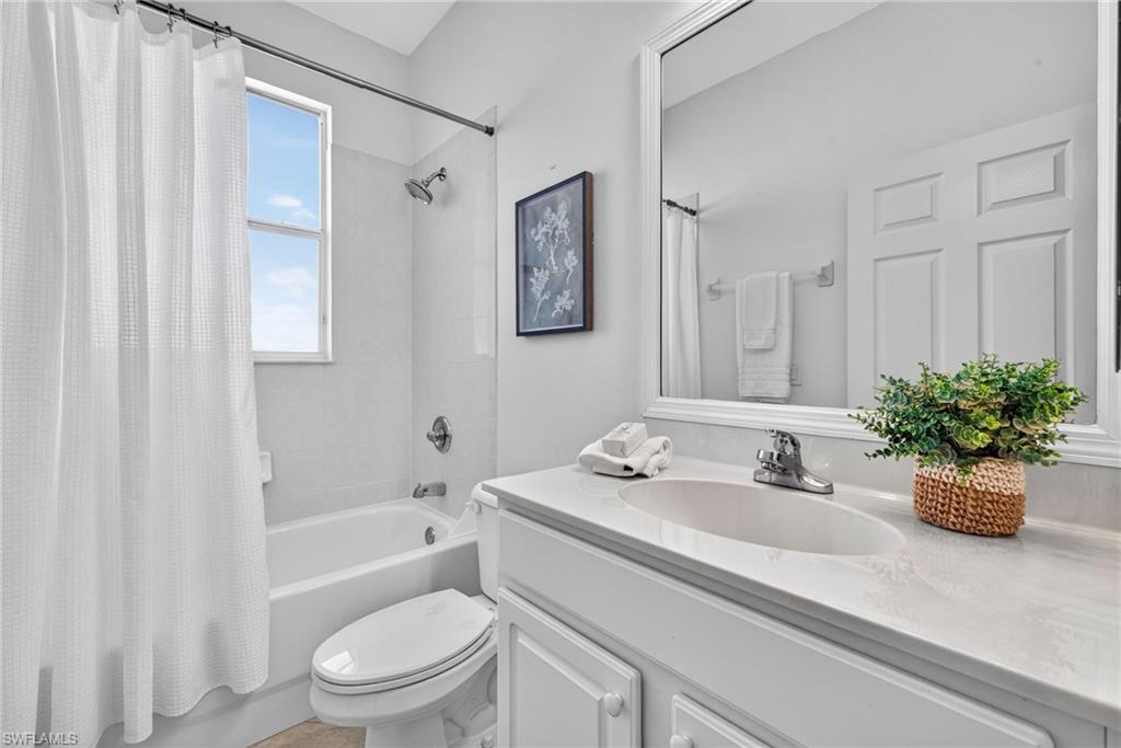 14088 Mirror Court Naples, FL 34114 - Photo 23 of 31 Bathroom 2 with shower / bath combo and vanity