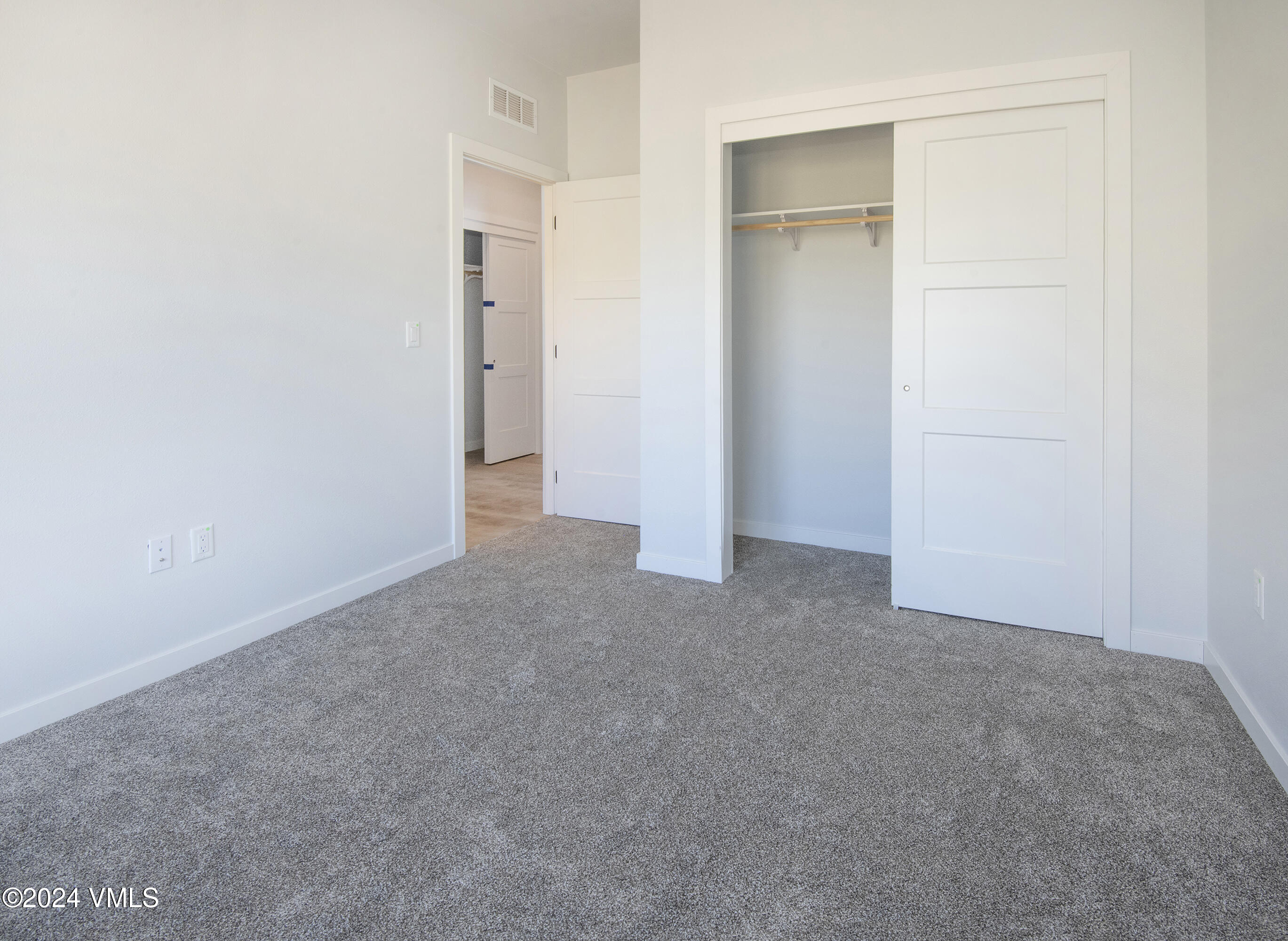 590 Blackhawk Road Gypsum, CO 81637 - Photo 31 of 42 an empty room with closet and a window