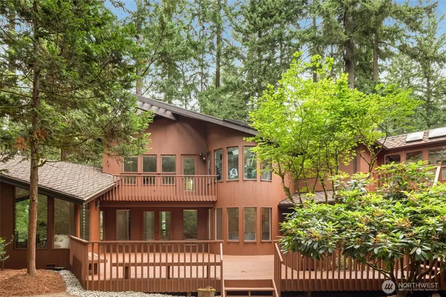 an aerial view of a house with yard swimming pool and outdoor seating