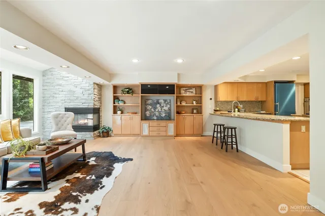 a kitchen with kitchen island a counter top space appliances and a center island