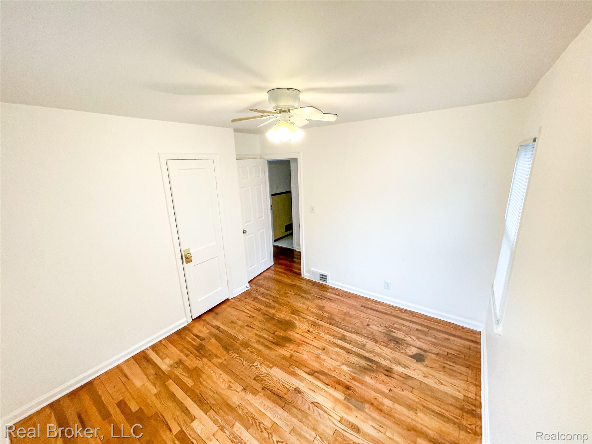 603 Vernier Road Grosse Pointe, MI 48236 - Photo 9 of 33 Unfurnished bedroom featuring light wood finished floors and ceiling fan