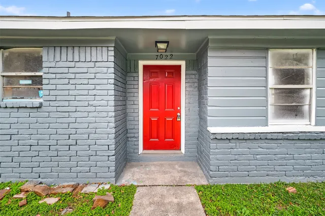 a view of door with a bench