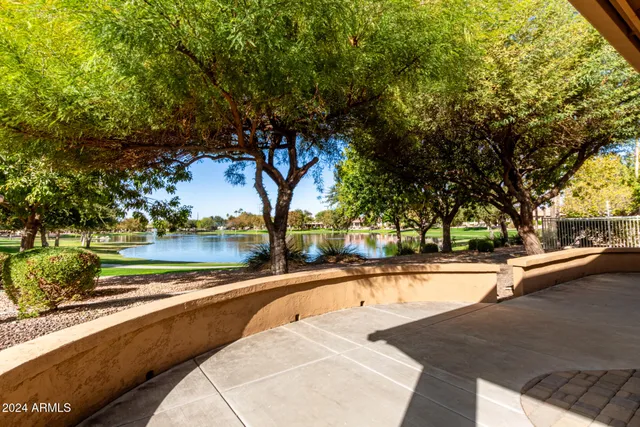 a view of a swimming pool with a patio